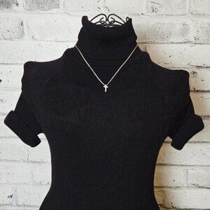 Micro Diamond Simulants Cross Pendant On A Silver tone Necklace